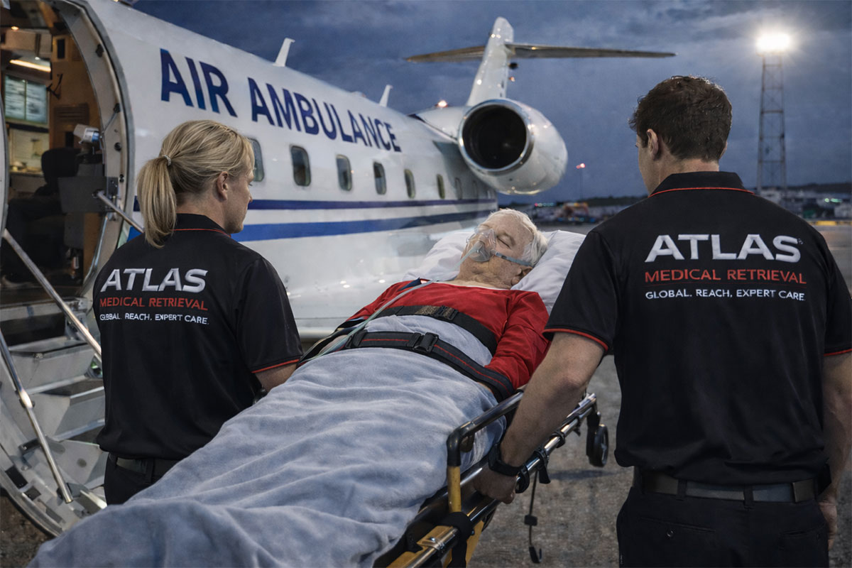 air ambulance staff helping man
